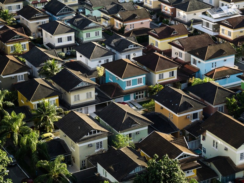 Couple reviewing documents together on laptop at home