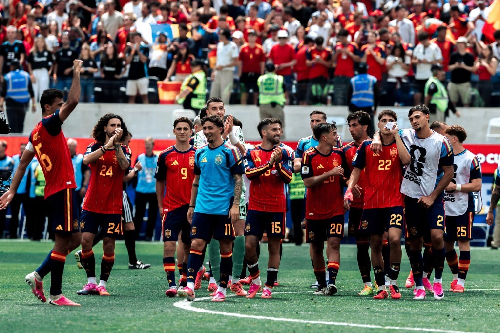 Spain players including Rodri, Cucurella, and Pedri acknowledge fans after their World Cup quarterfinal win over Belgium