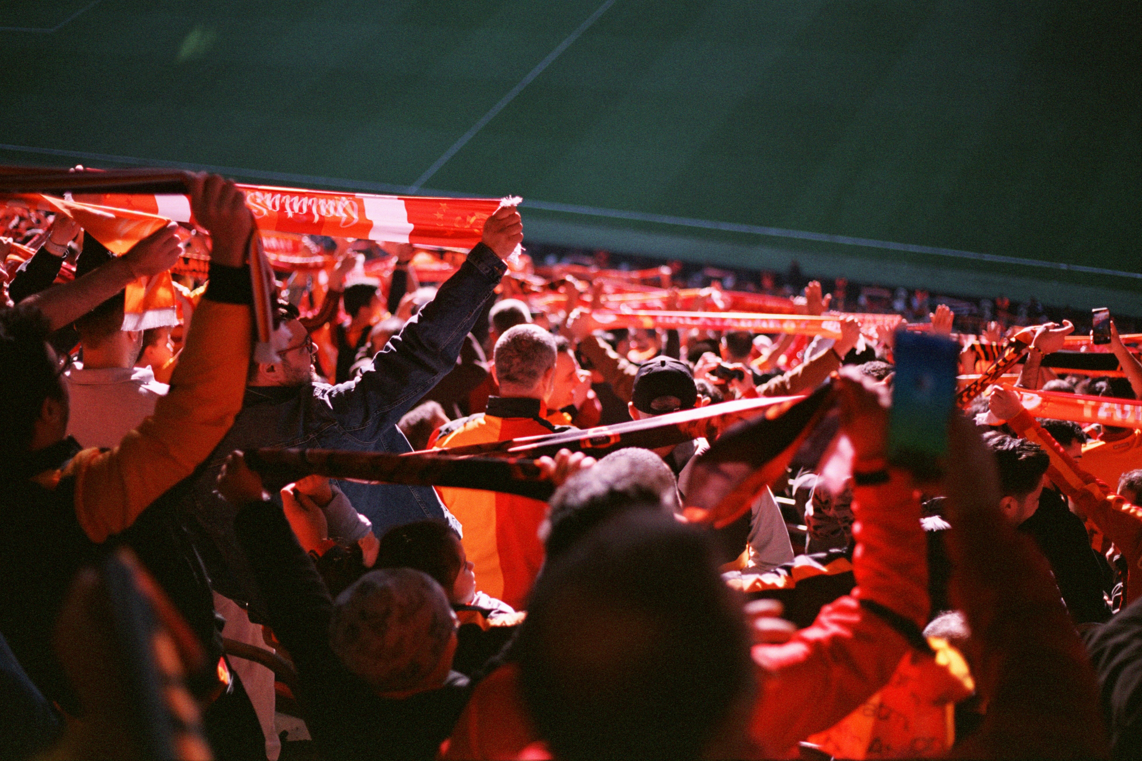 A large group of people sitting in a stadium