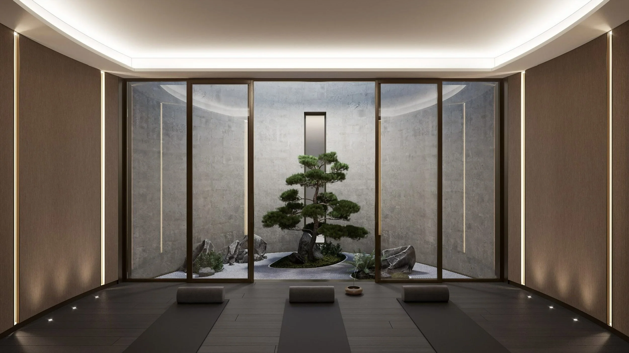 Meditation room with yoga mats facing a glass-enclosed indoor garden with a bonsai tree