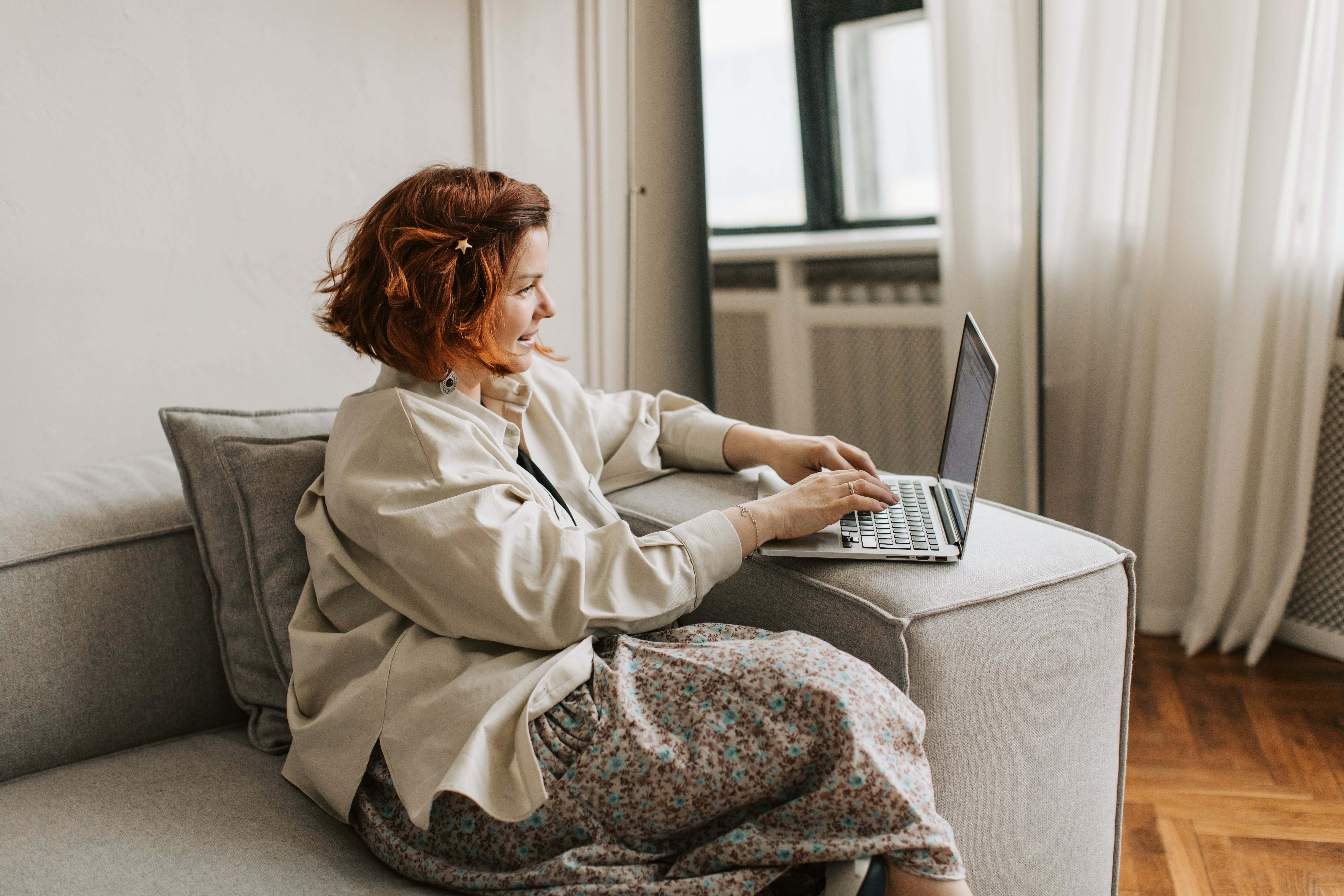 Woman sitting on a sofa exploring canvassing and marketing strategy 