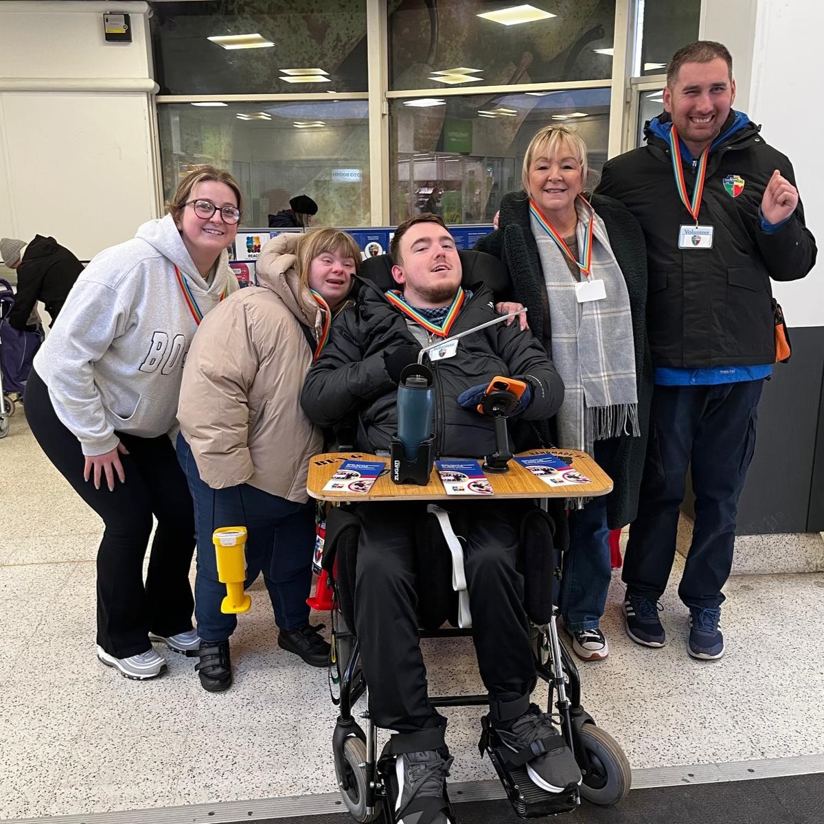 A man stading with Surfboard