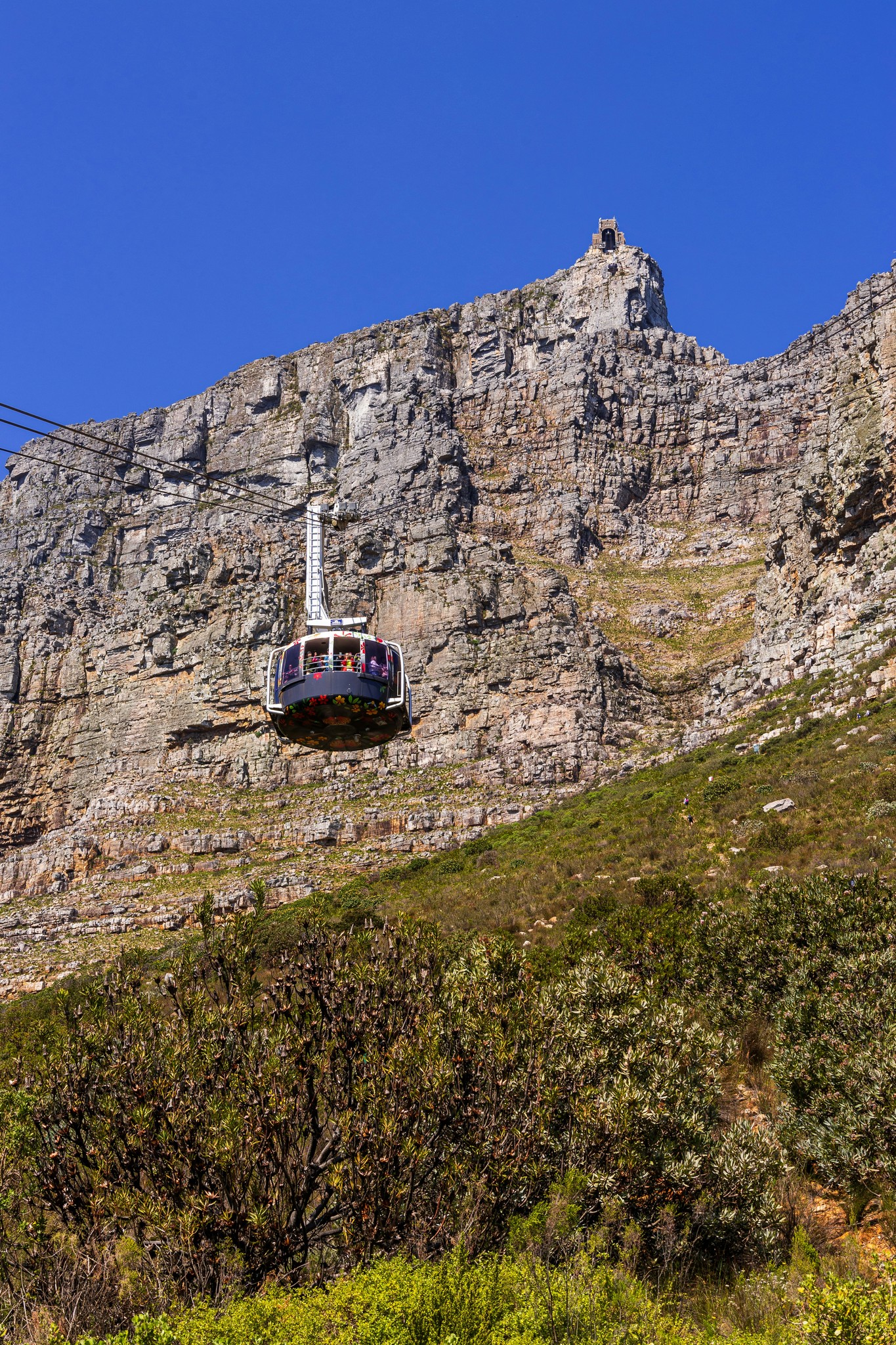 A cable car going up the side of a mountain
