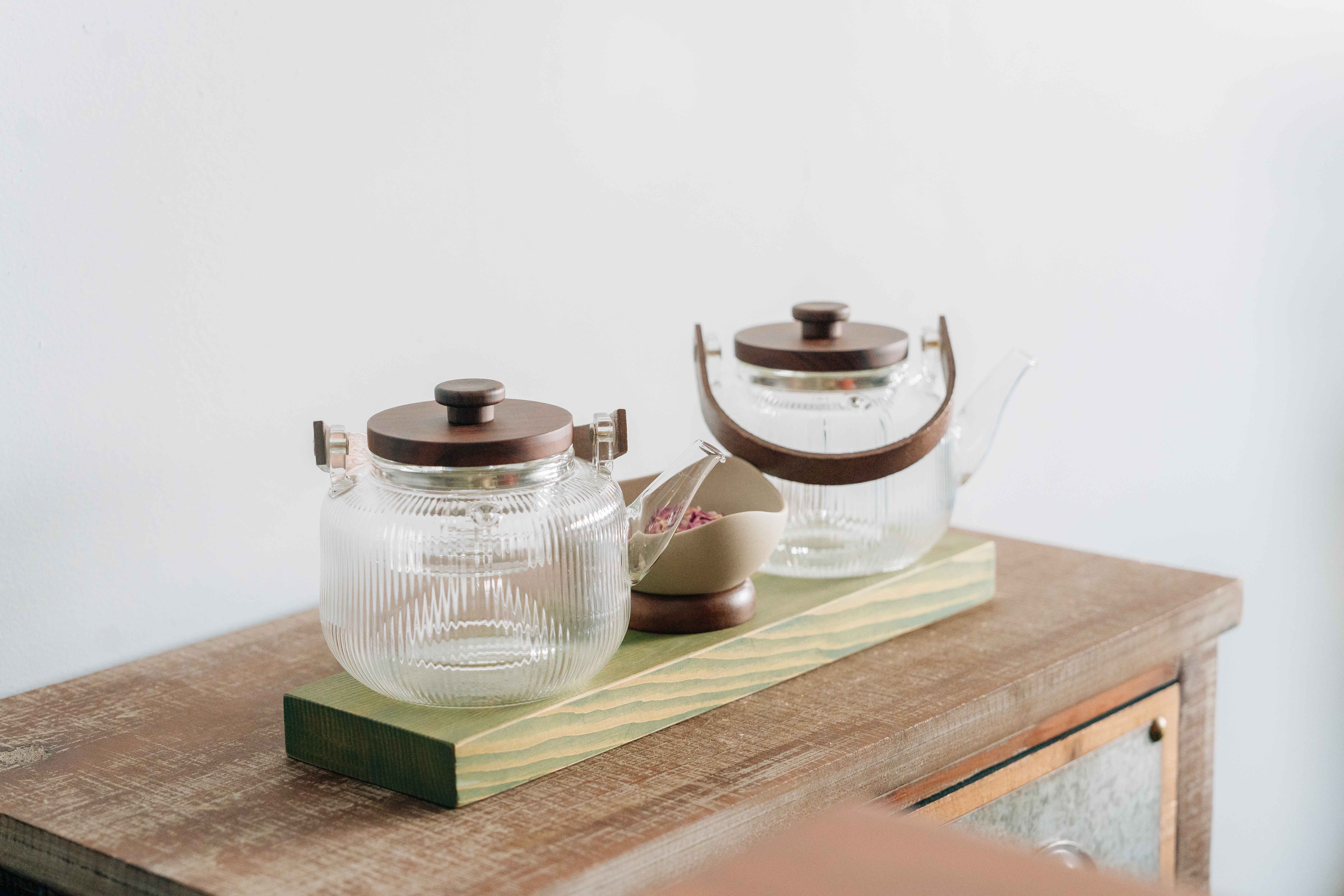 three men and one woman laughing during daytime