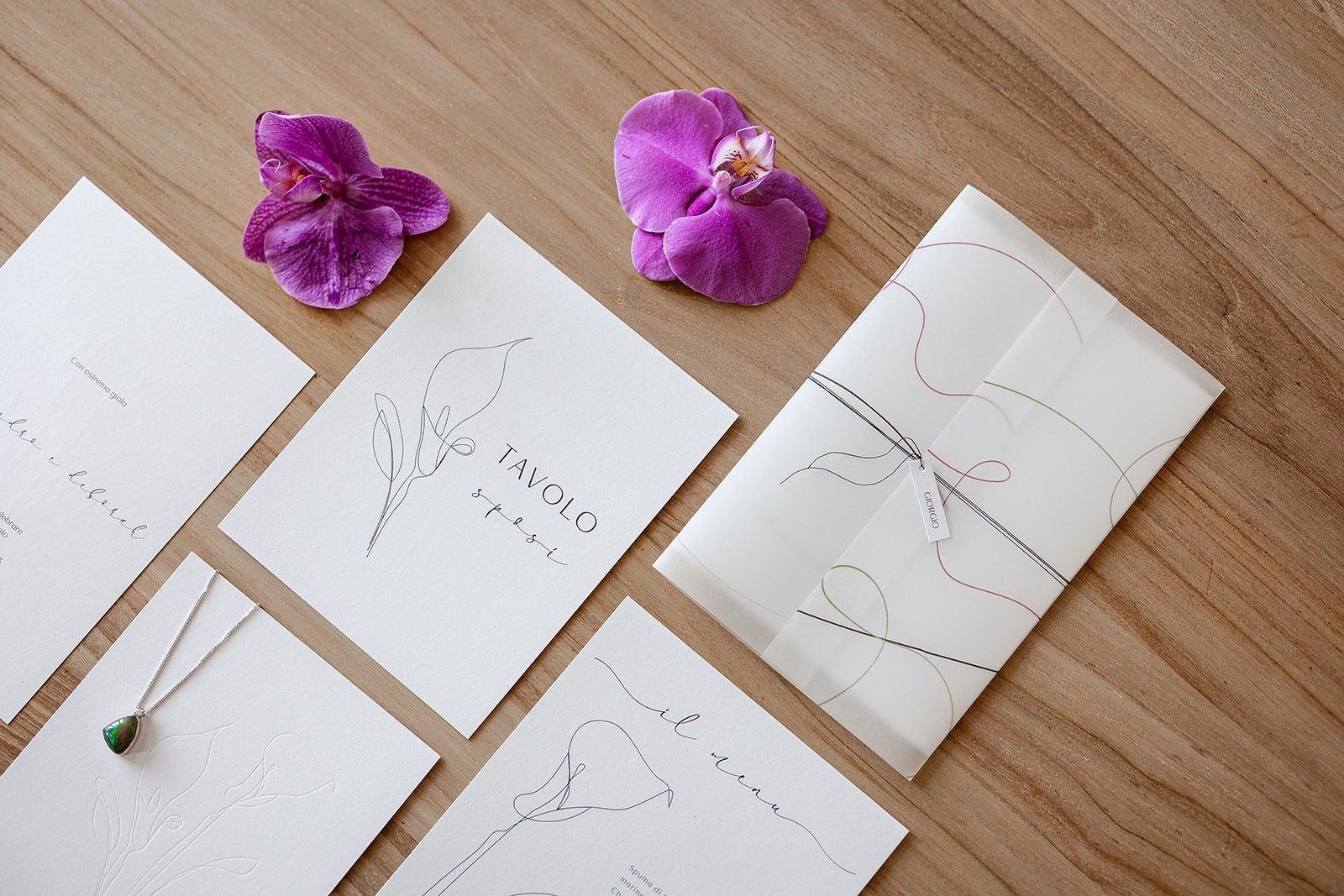 Close-up of a dark green leaf showing its textured surface and central vein against a muted background.