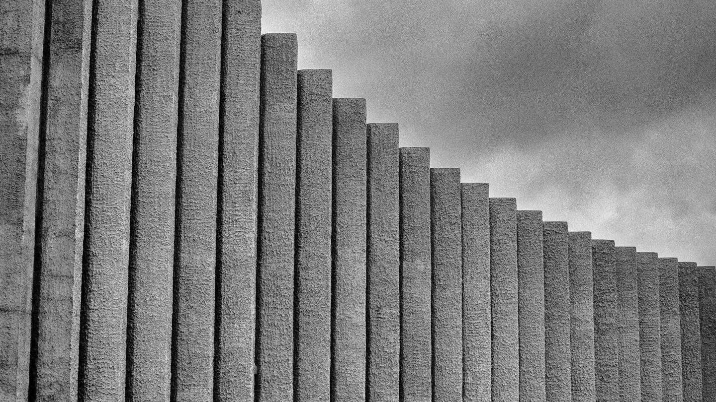 Concrete fins stepping up against the sky — photo by Stephane Yaich on Unsplash