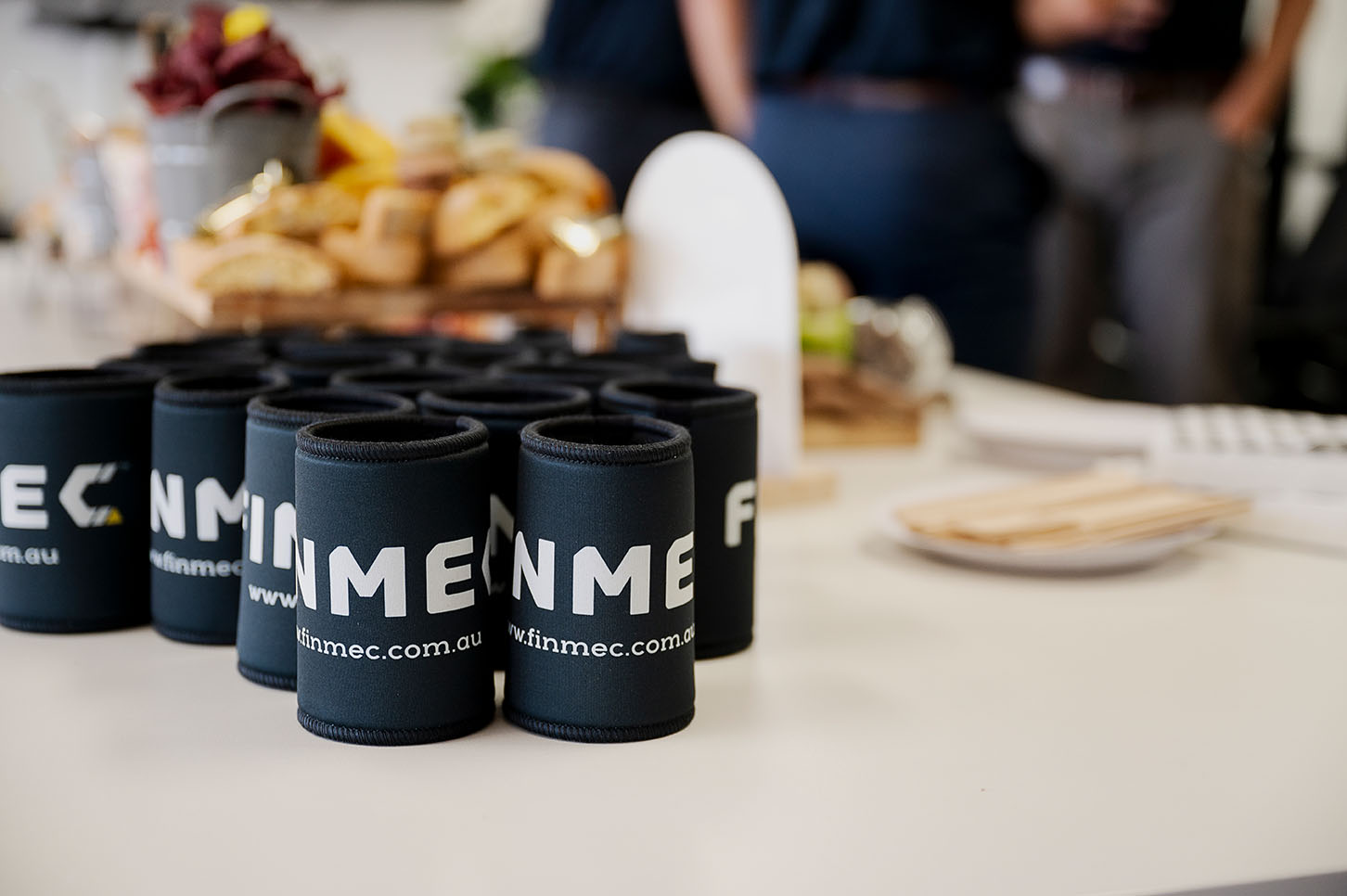 Cluster of translucent pink glass pendant spheres hanging on white—modern lighting décor.