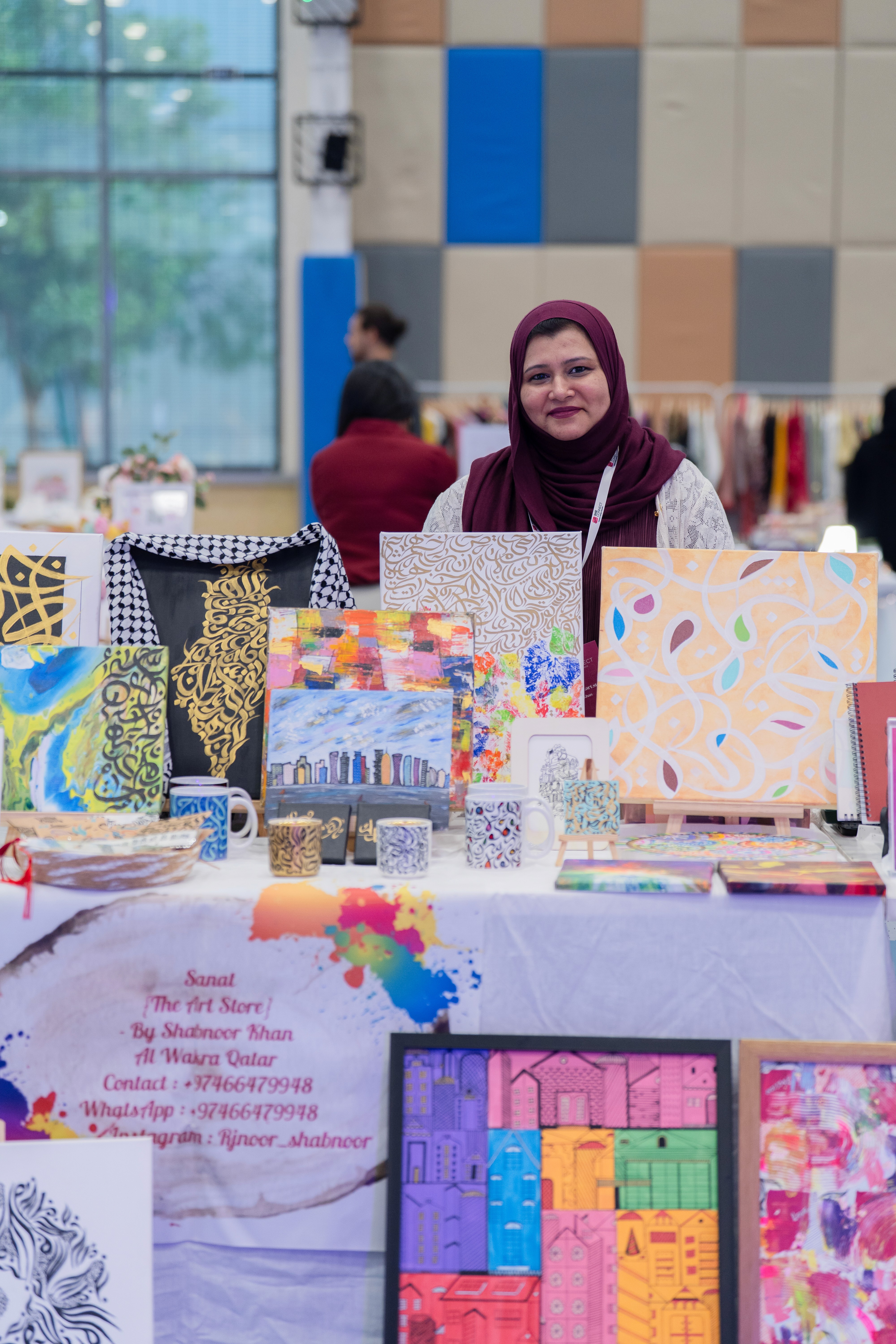 Close-up of a dark green leaf showing its textured surface and central vein against a muted background.