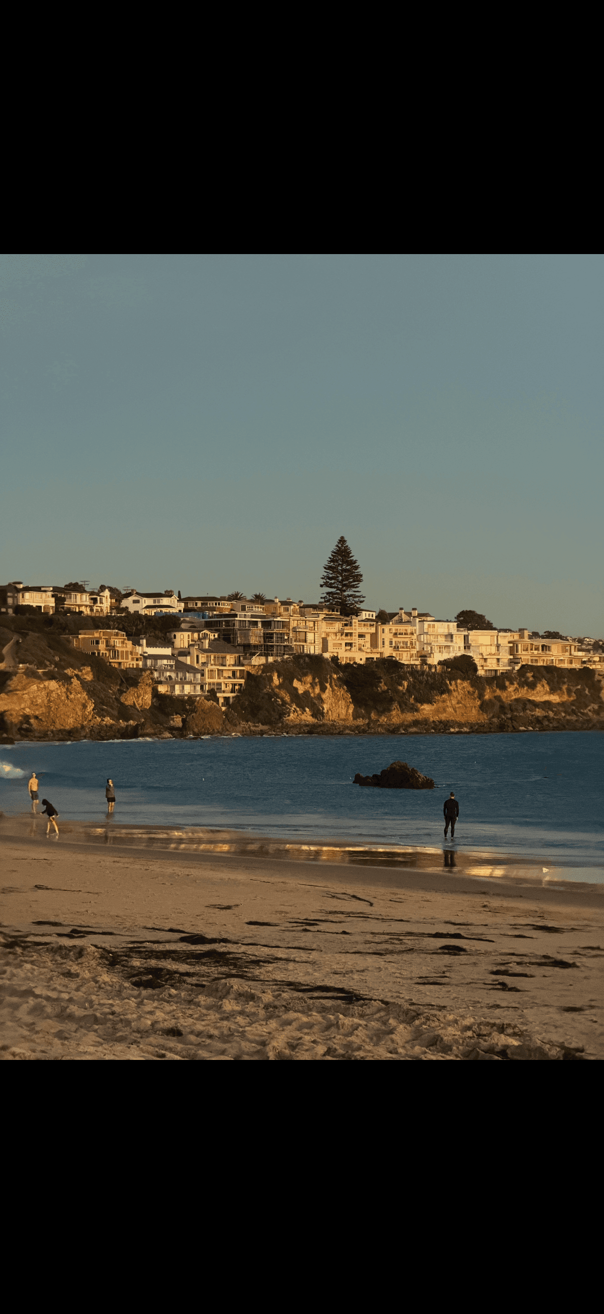 Nadina working in front of glowing monitor in an overhead angle