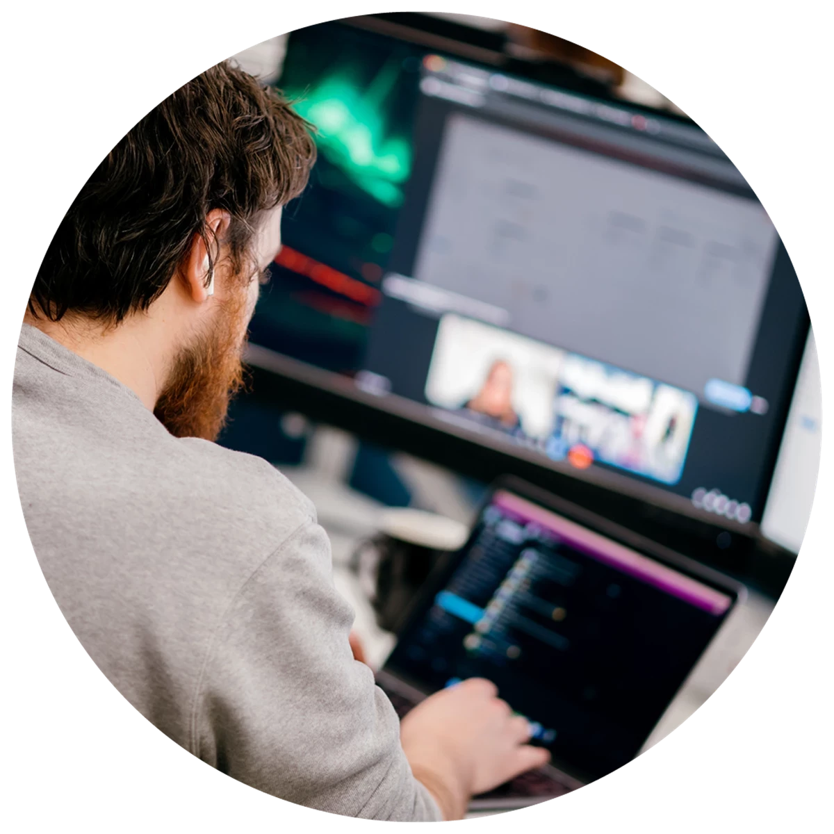 Opencast team member working at a computer in an office space