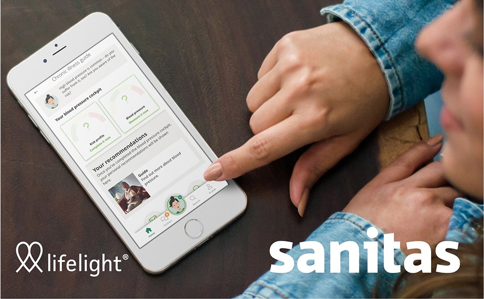 Woman using a mobile phone showing the Sanitas platform that's using Lifelight