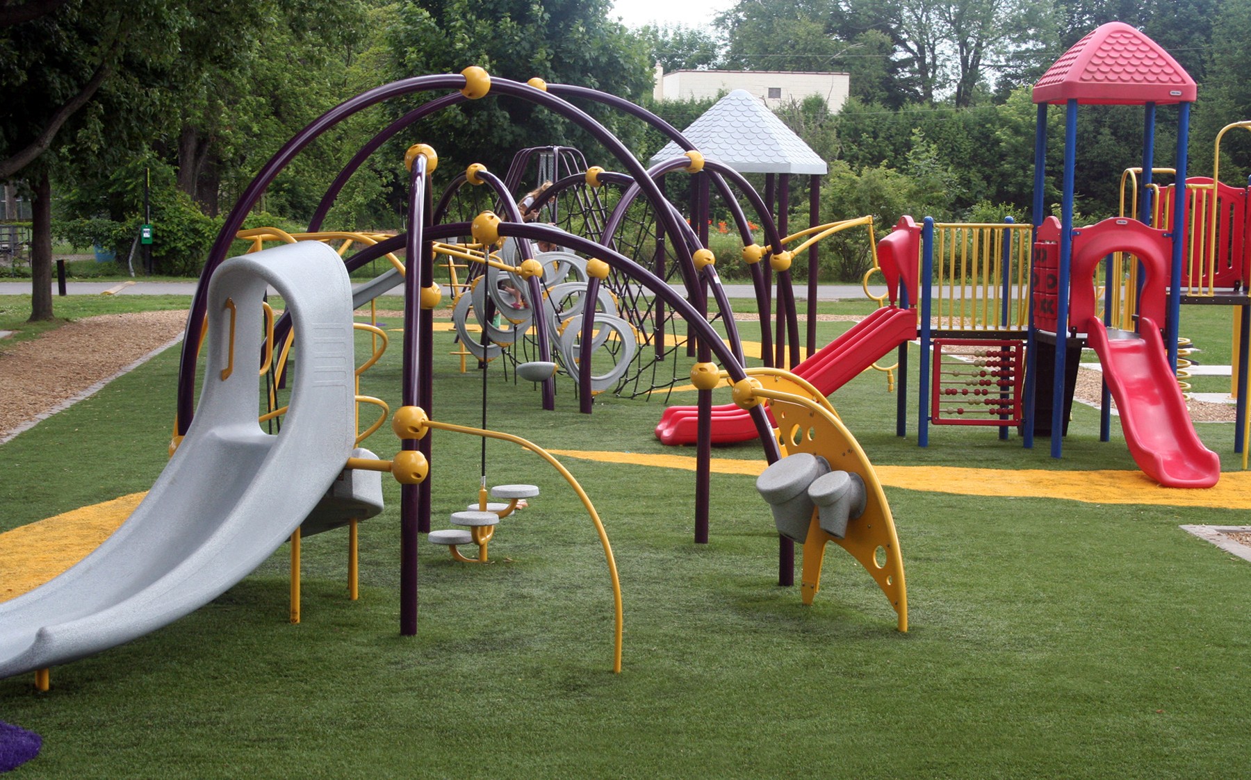 A lively playground with everything a child could want nestled among AGL Grass and trees, encouraging children to play and discover.