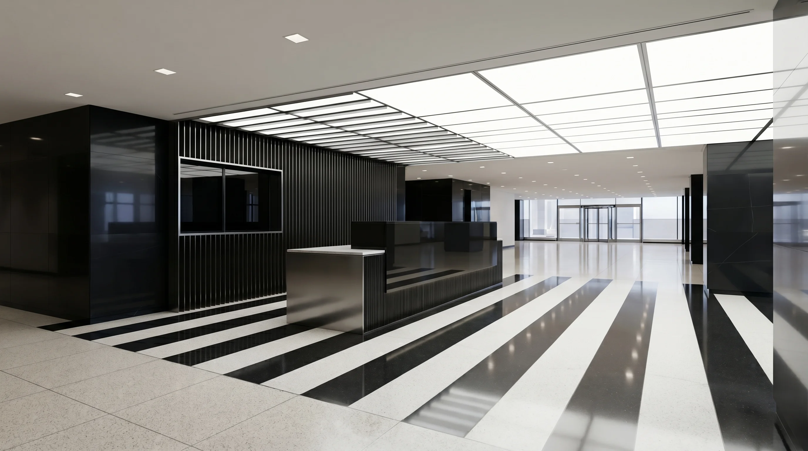 Renovated Class A office lobby at 59 Maiden Lane featuring sleek architectural lines, polished black and white stone flooring, a metallic reception desk, and high-end modern finishes.