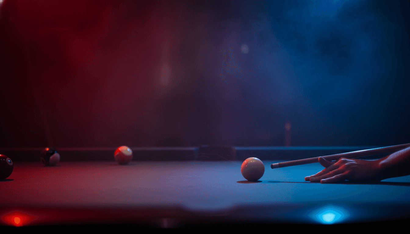 A talent recruiter with a soft smile working on her laptop in the office. The angle is on her face so we can't see what's is on the screen. She is wearing a blazer