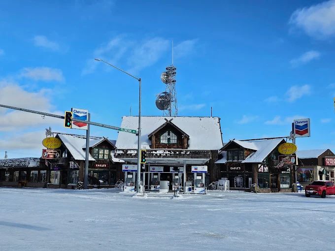 lake landscape with clear blue water, forest and mountains at the backdrop