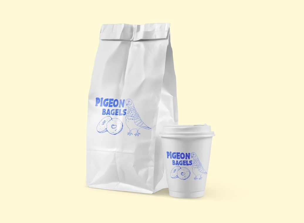 White product packaging and tissue paper mockup with subtle pigeon bagel branding