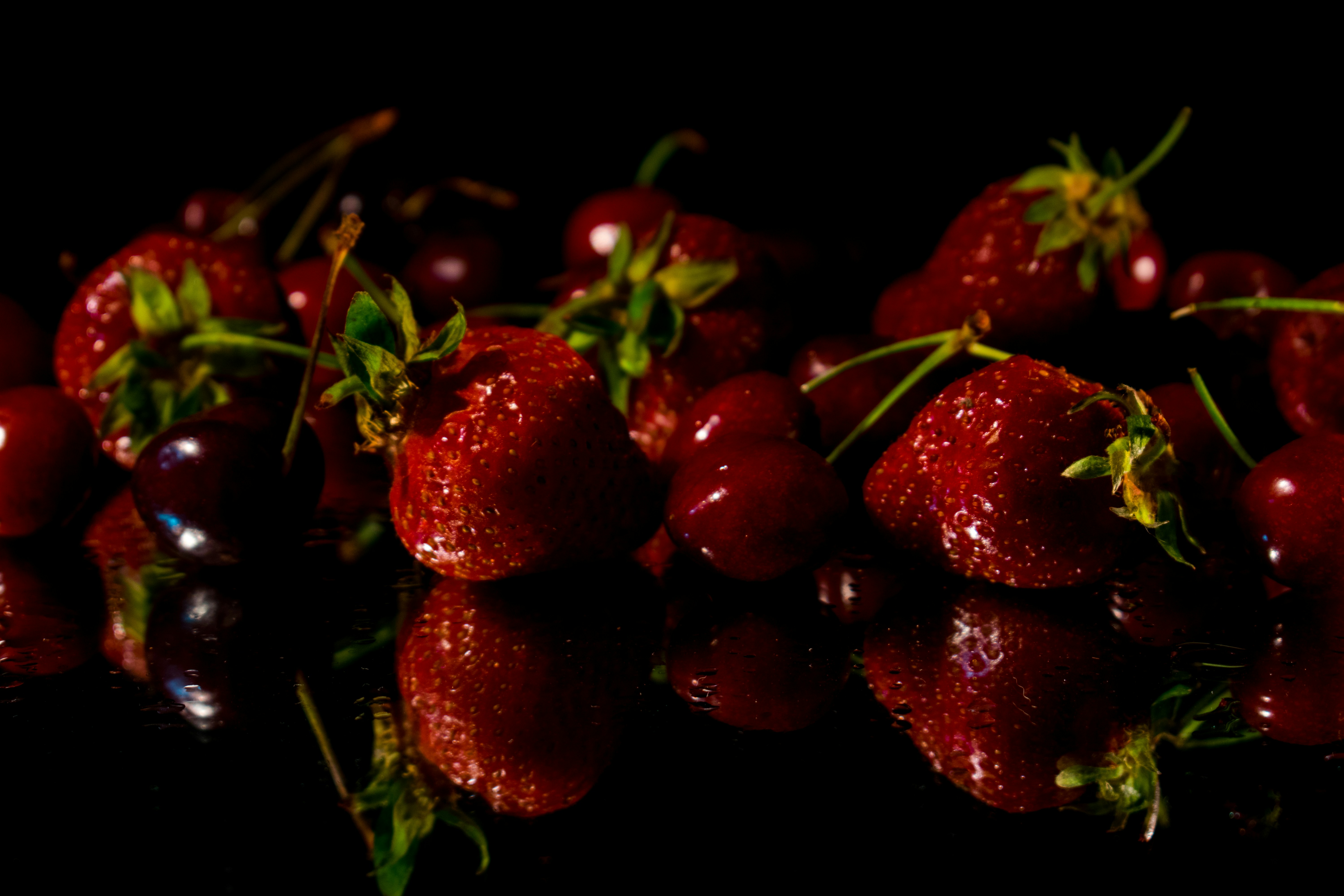 a group of strawberries sitting on top of a table