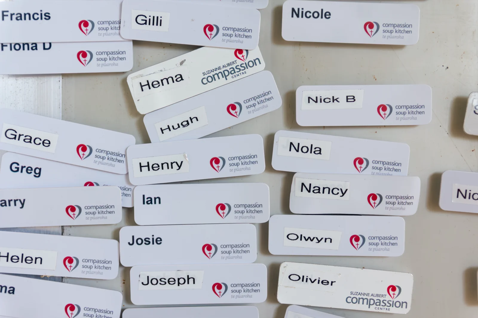 Compassion name badges arranged on a table
