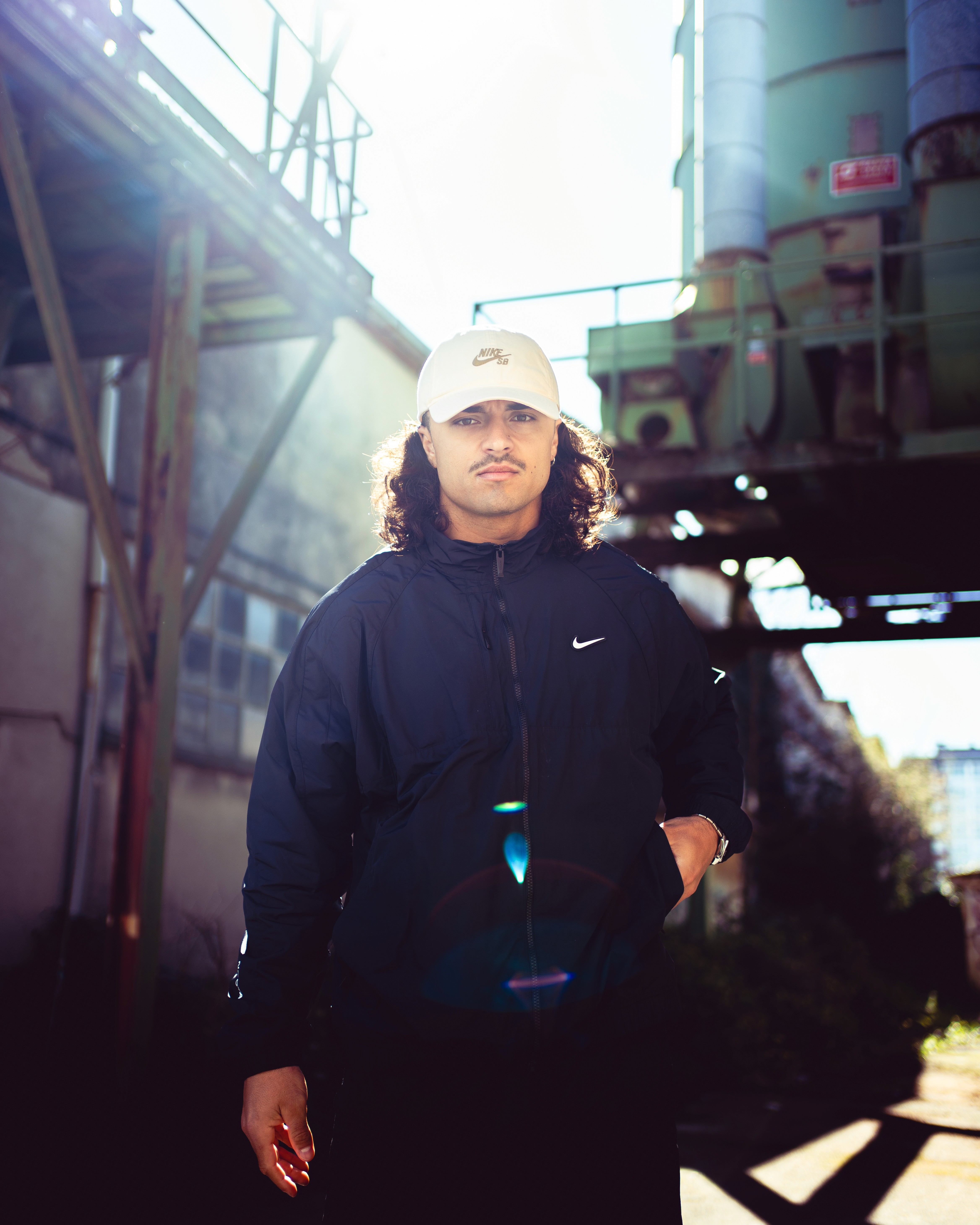  A woman in a helmet with a light trail, suggesting movement or speed in a dynamic outdoor setting.