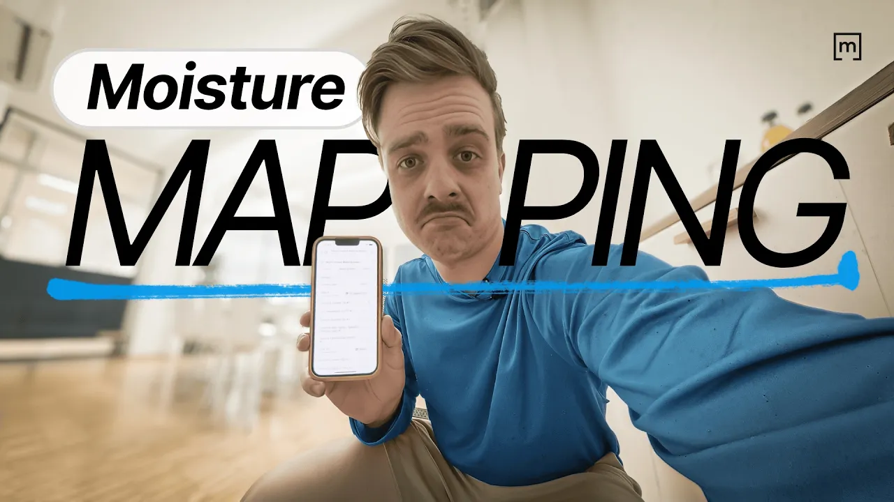 a guy showing a phone to record moisture mapping