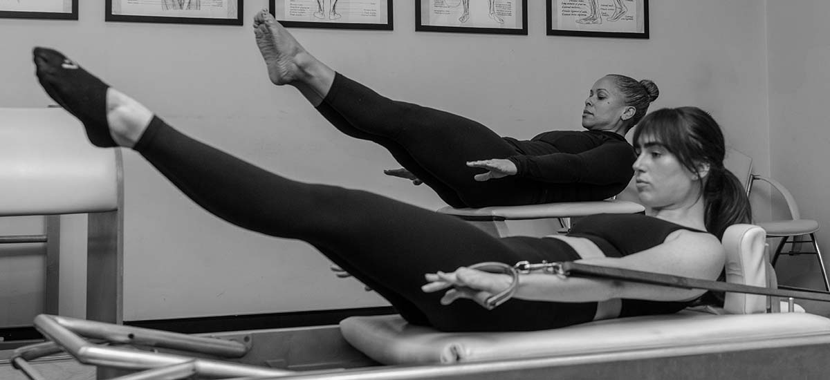 Two girls doing Pilates at True Pilates Method Camden NSW