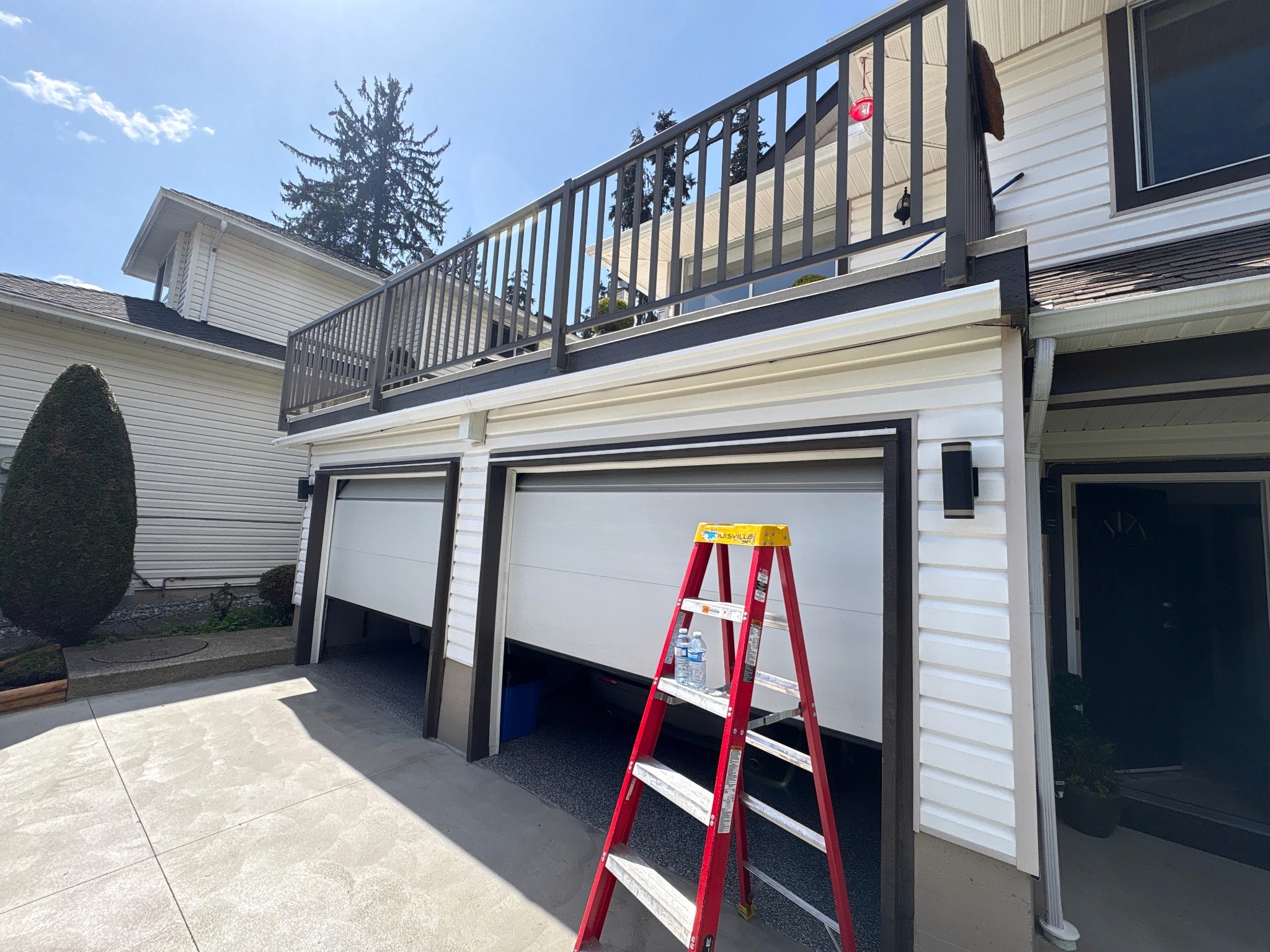 Completed fascia and gutter repair beneath an elevated residential deck.