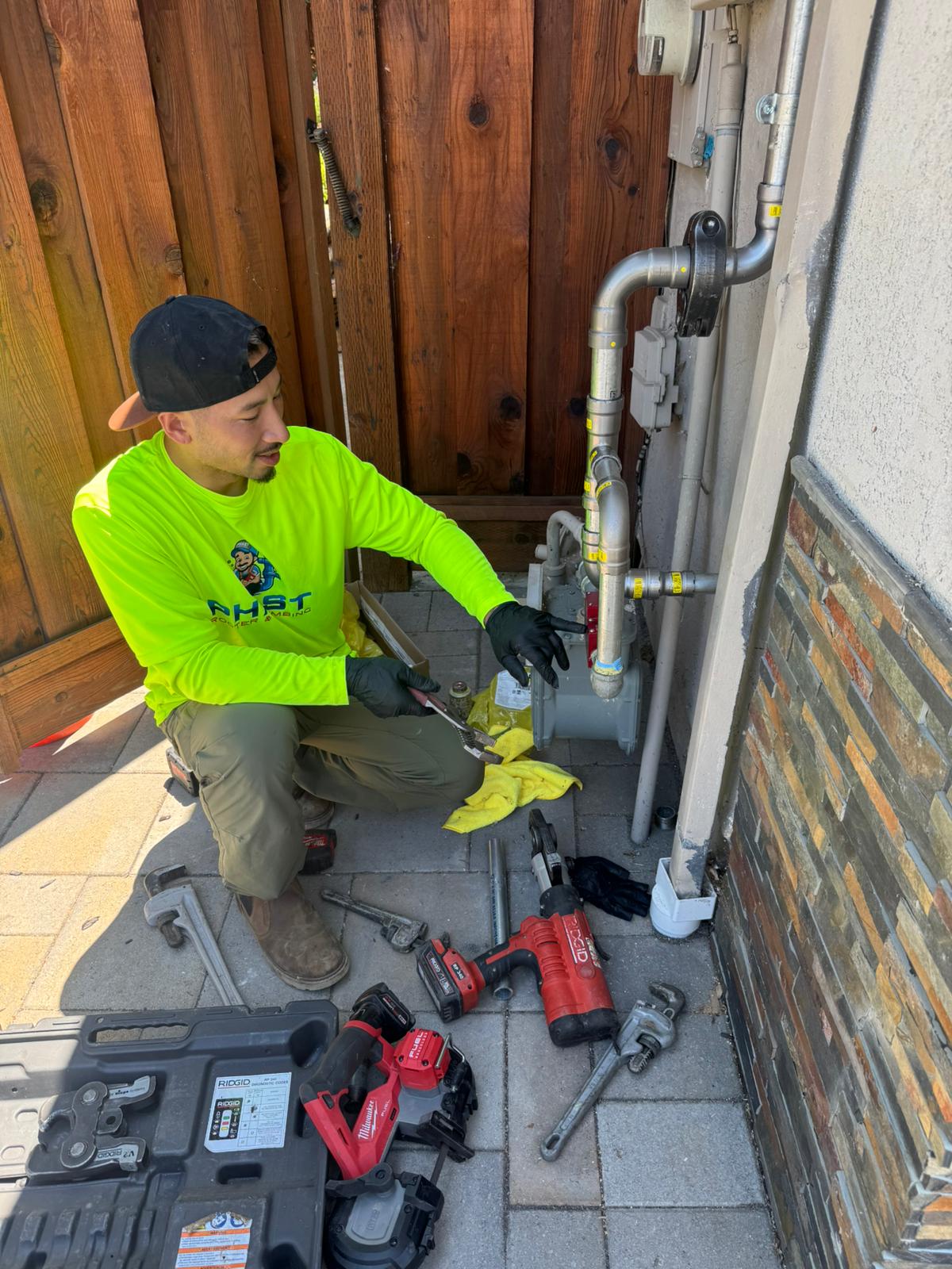 Plumber fixing a pipe