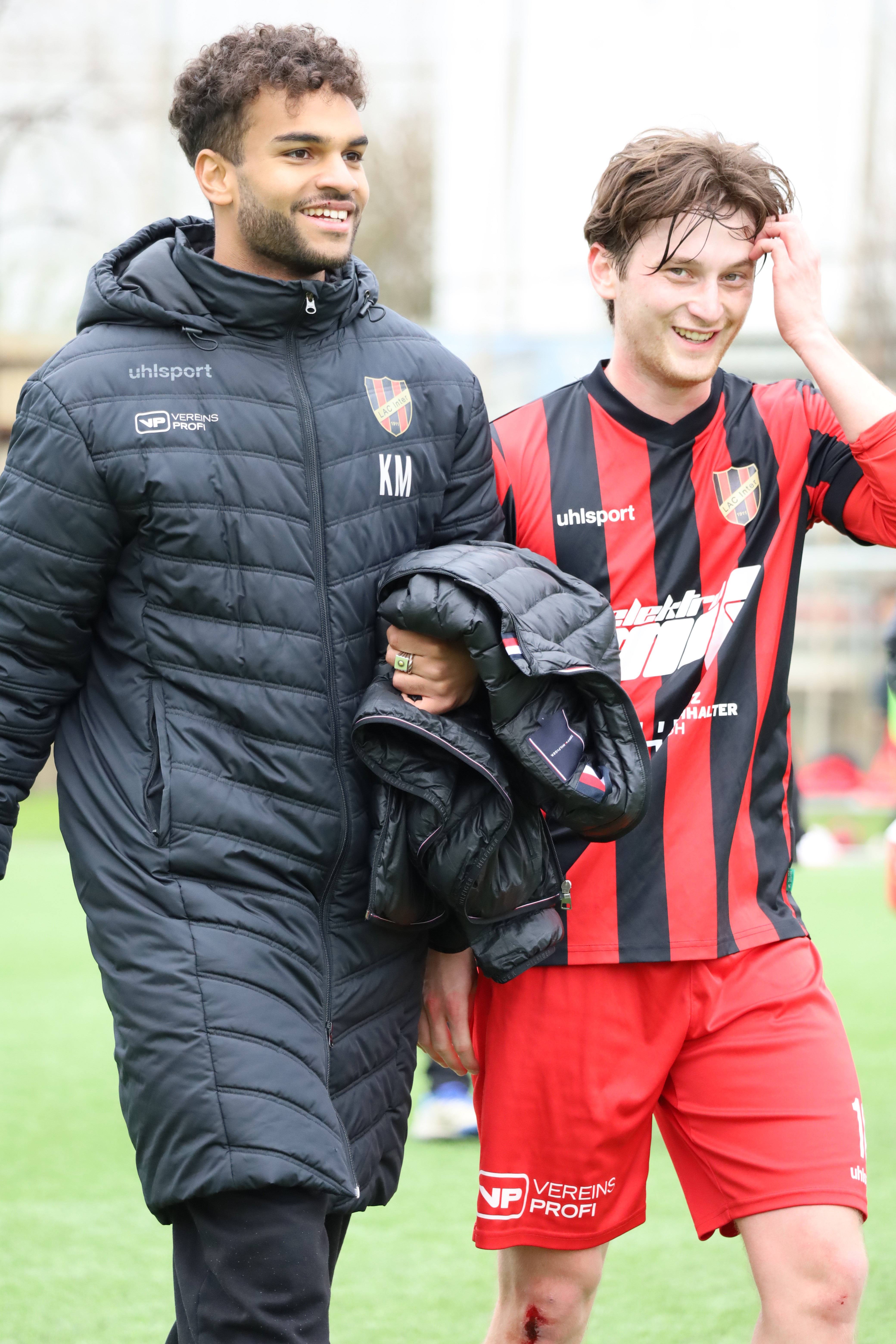 Two players laugh after the game