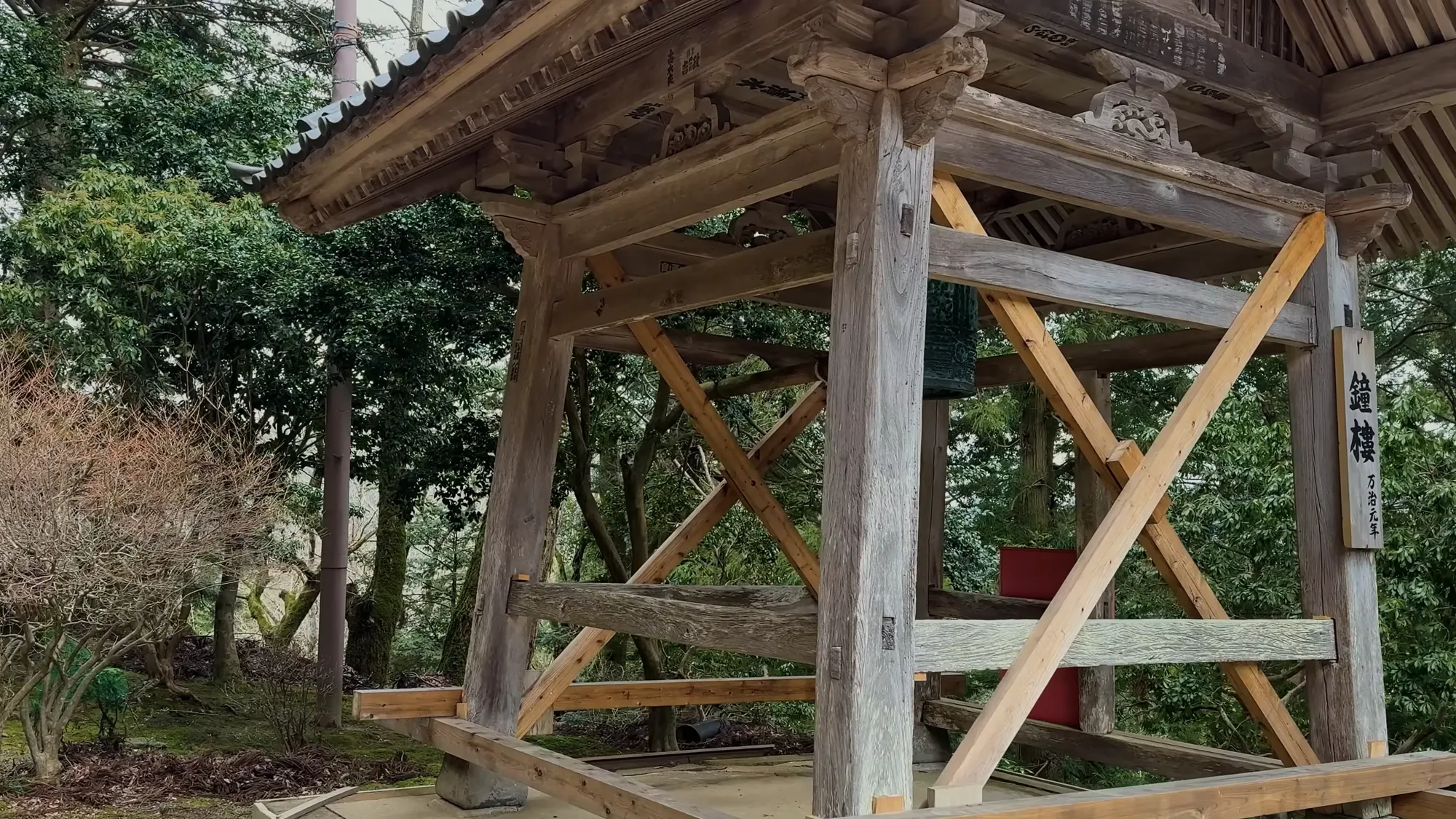 A timber bell tower in the grounds of Onsenji temple above Kinosaki.
