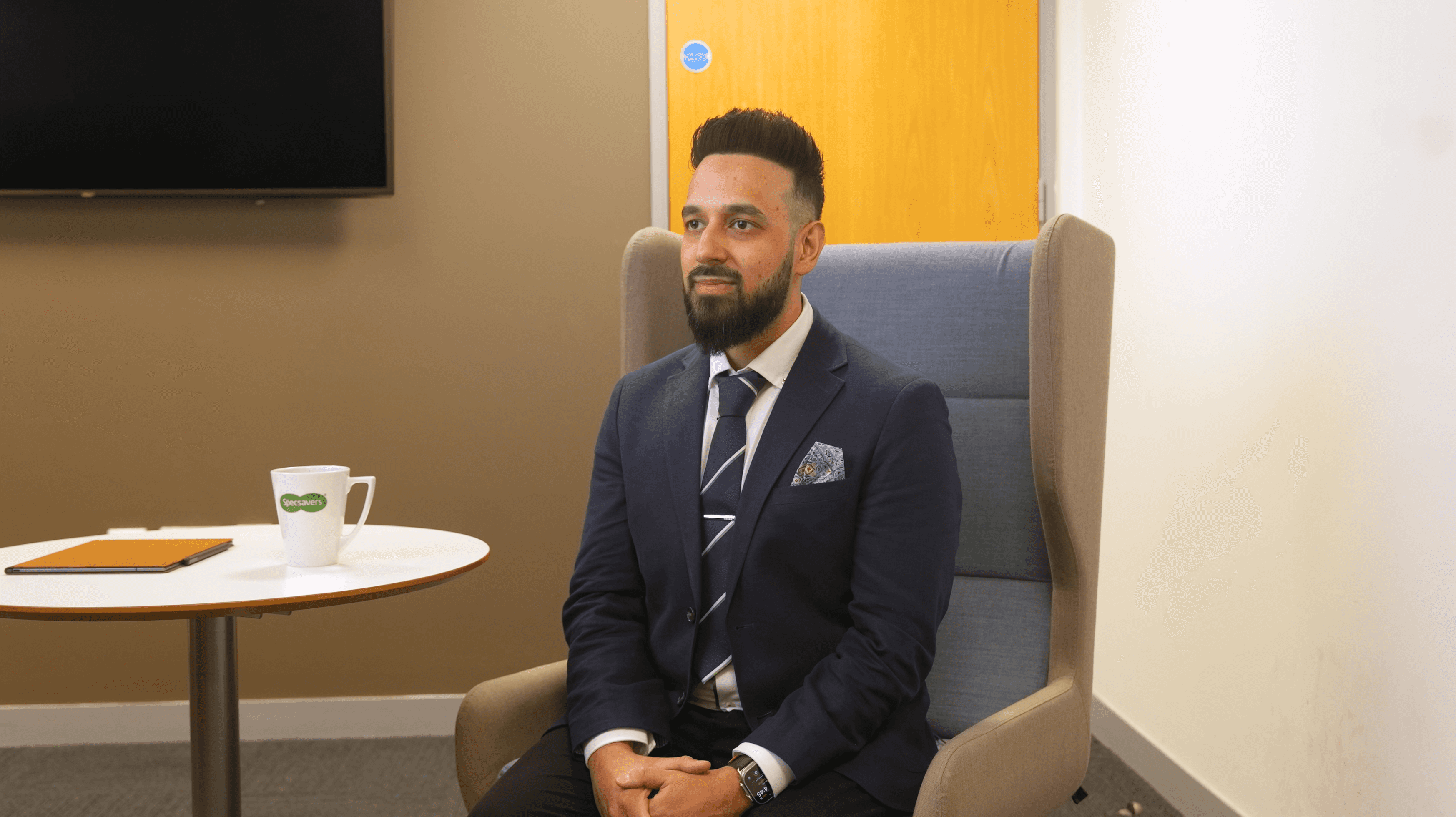 An screengrab of a video of an Optometrist being interviewed. 