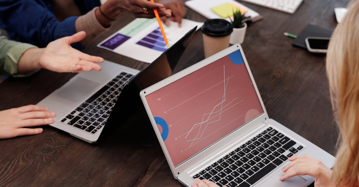 Group of professionals discussing data analytics in a modern office setting.