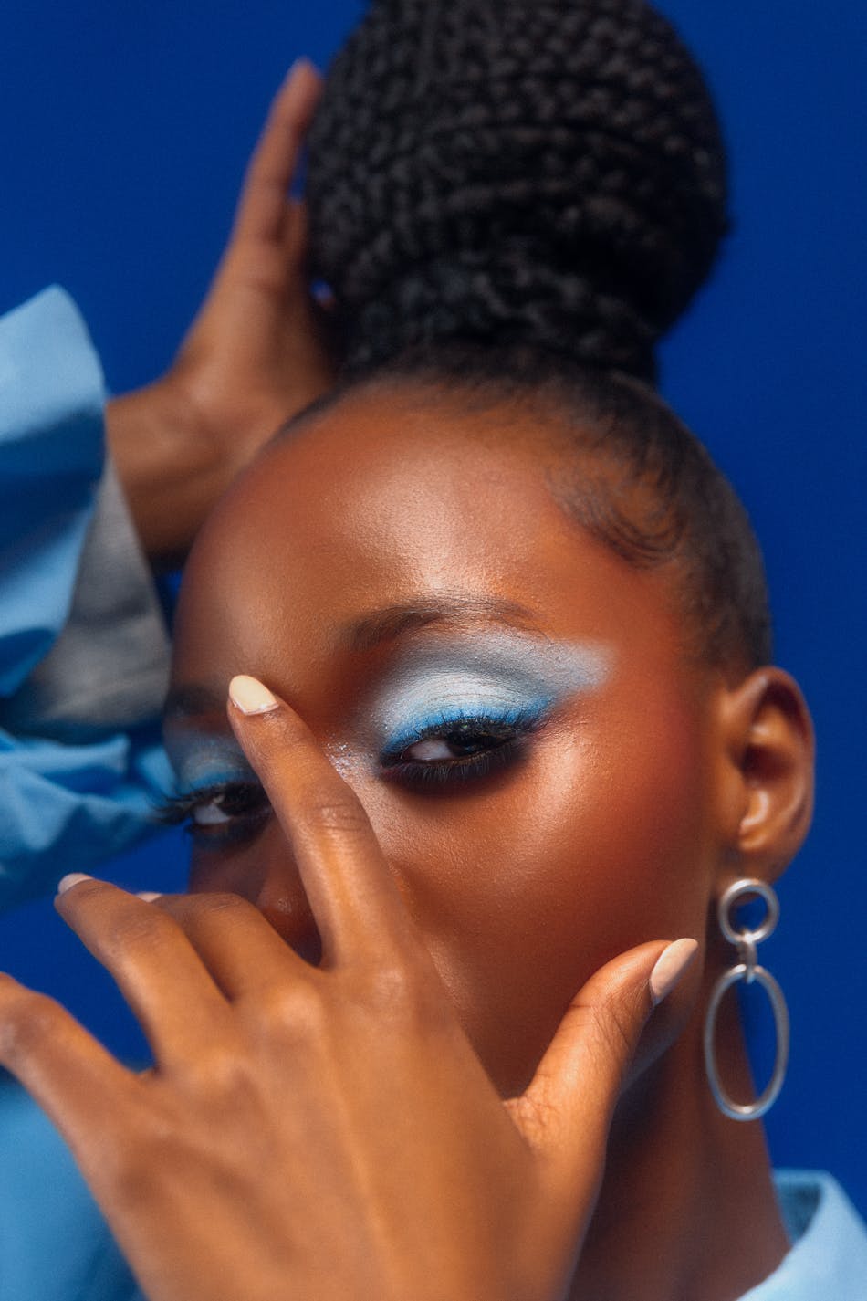 Fashion portrait of a women with blue make-up