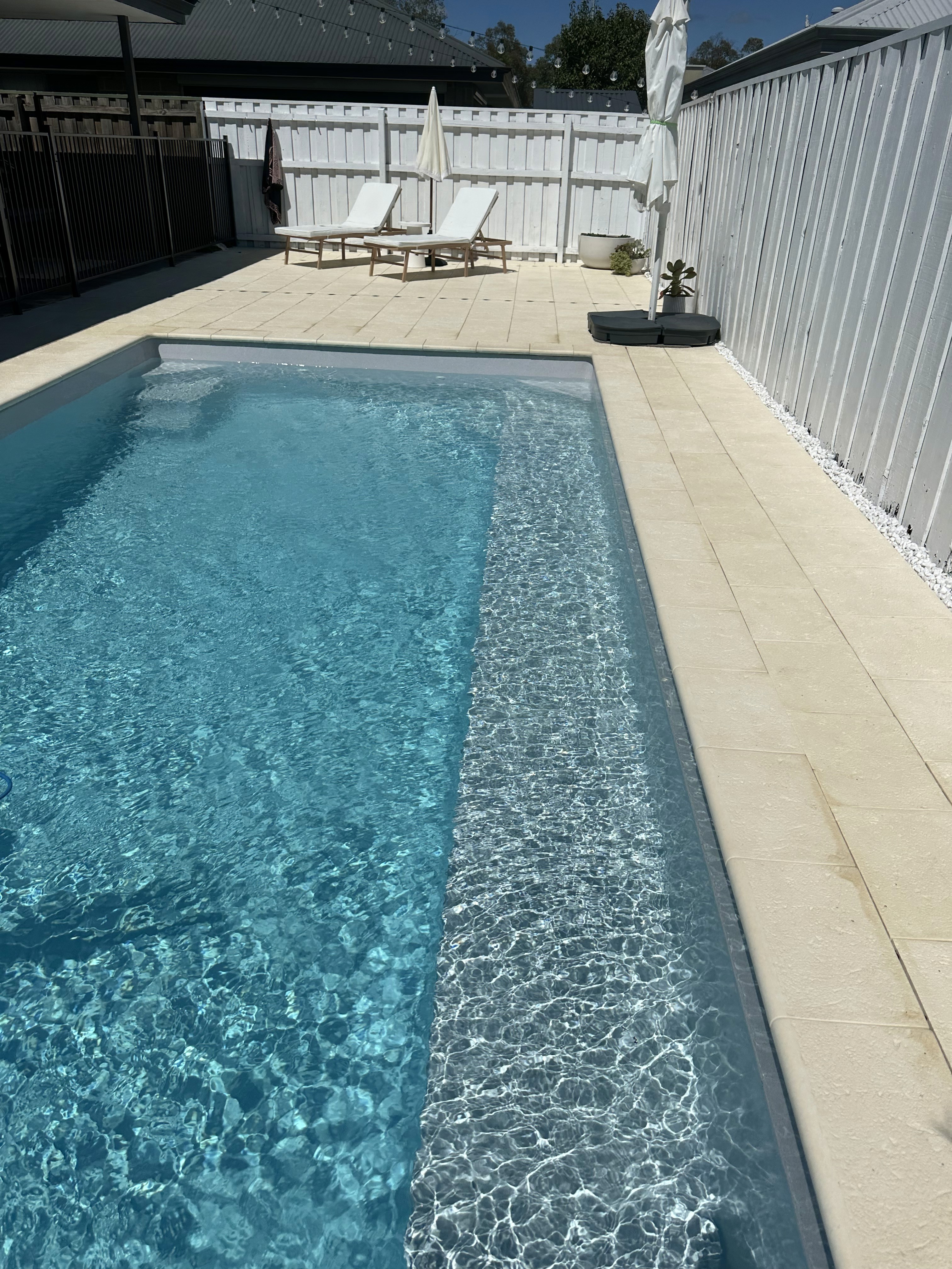 Electrician drilling in a wall