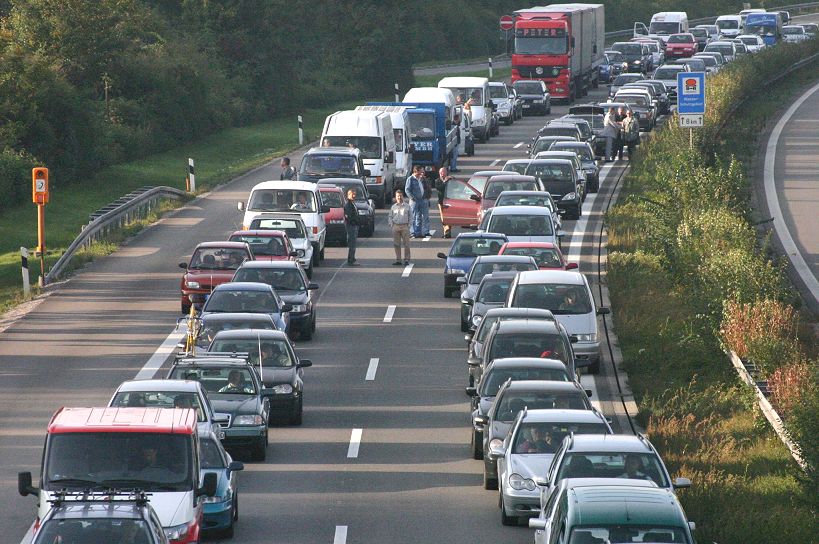  Emergency responders managing a hazardous materials truck accident on a congested autobahn near Grevenbroich