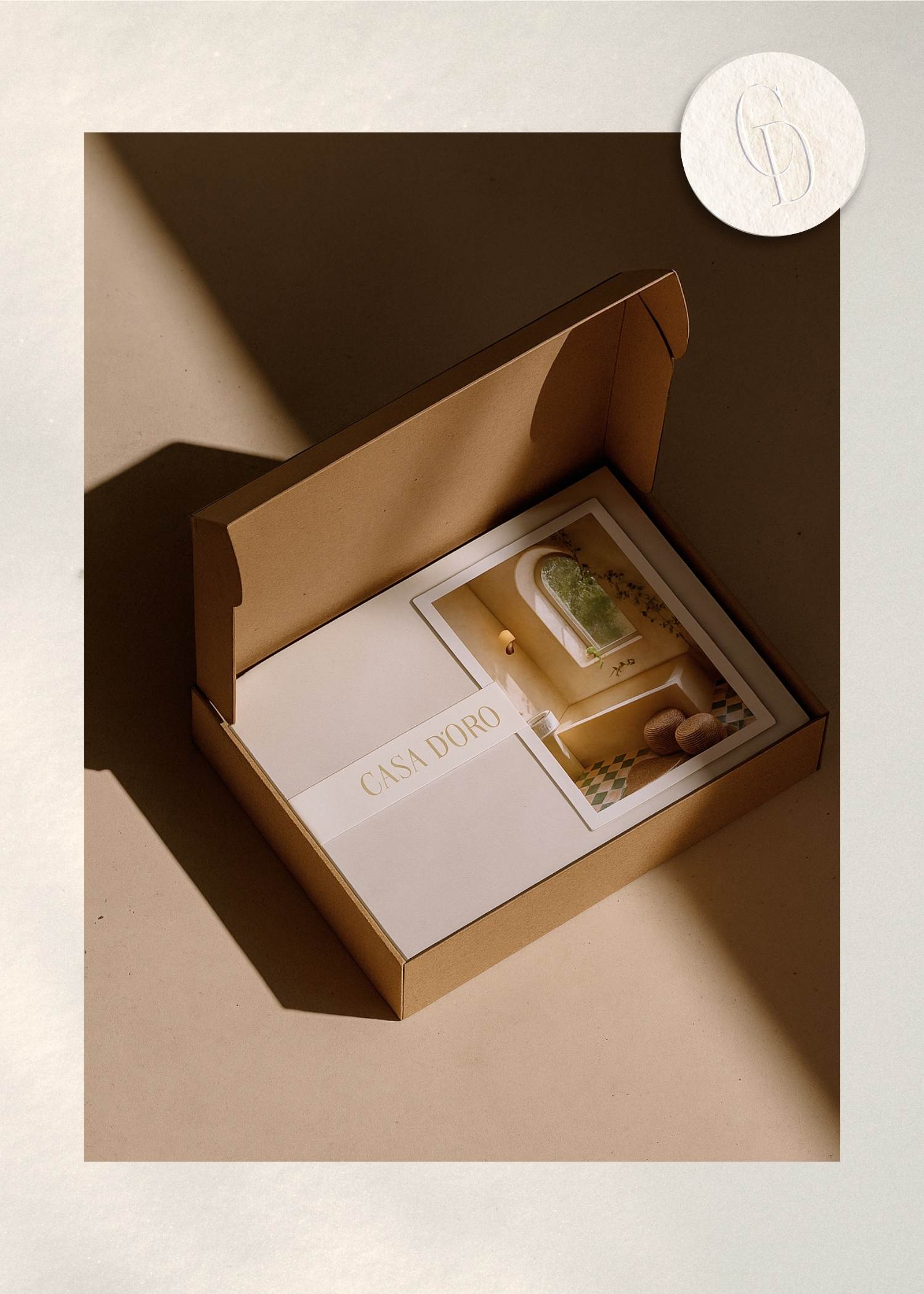 Casa D’Oro luxury product packaging design featuring textured materials, brochure, and strategy kit.