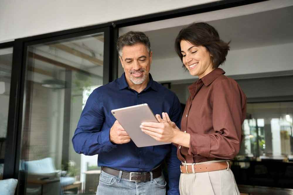 Two people exchanging contacts to stay in touch in the future