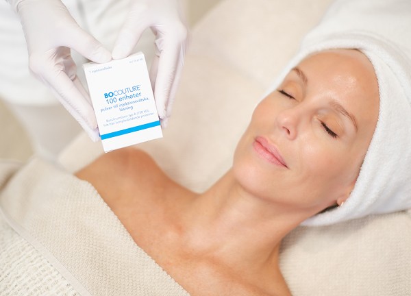 Kvinna med botox injektion