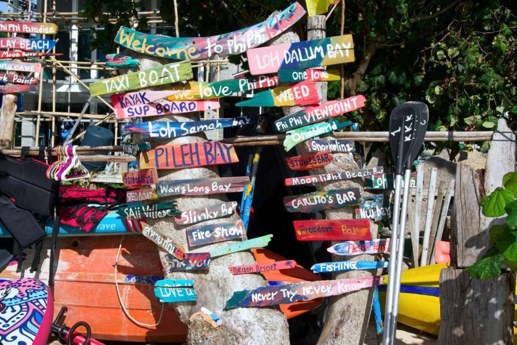 Lots of colourful signs on Phi Phi Island beach