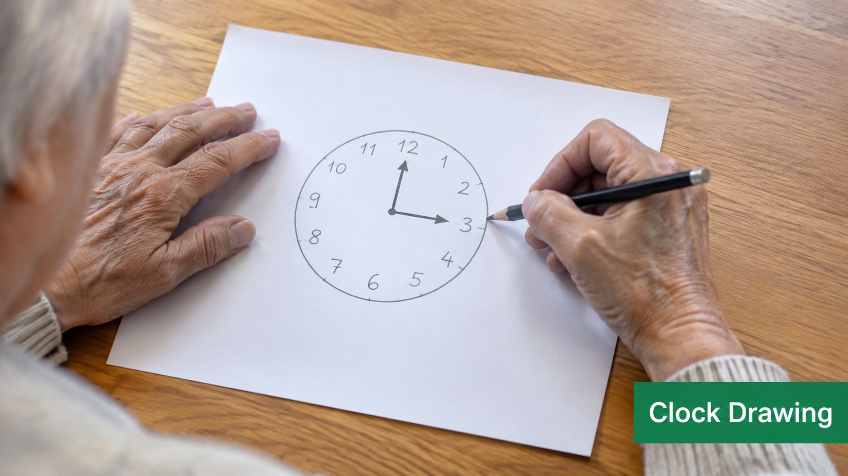 An elderly person sits at a wooden table while drawing a clock face on white paper.