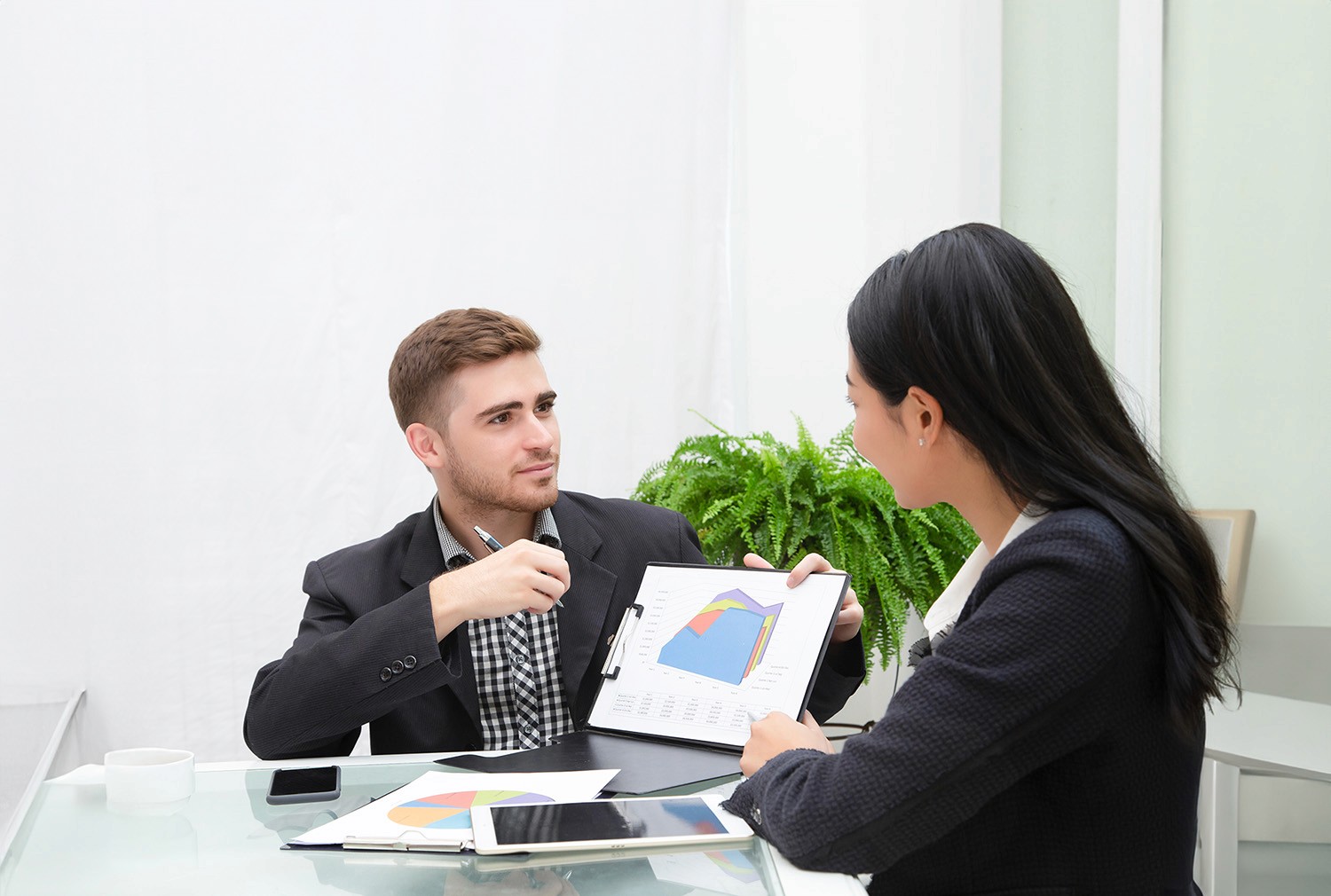 Business man making a presentation to a business woman