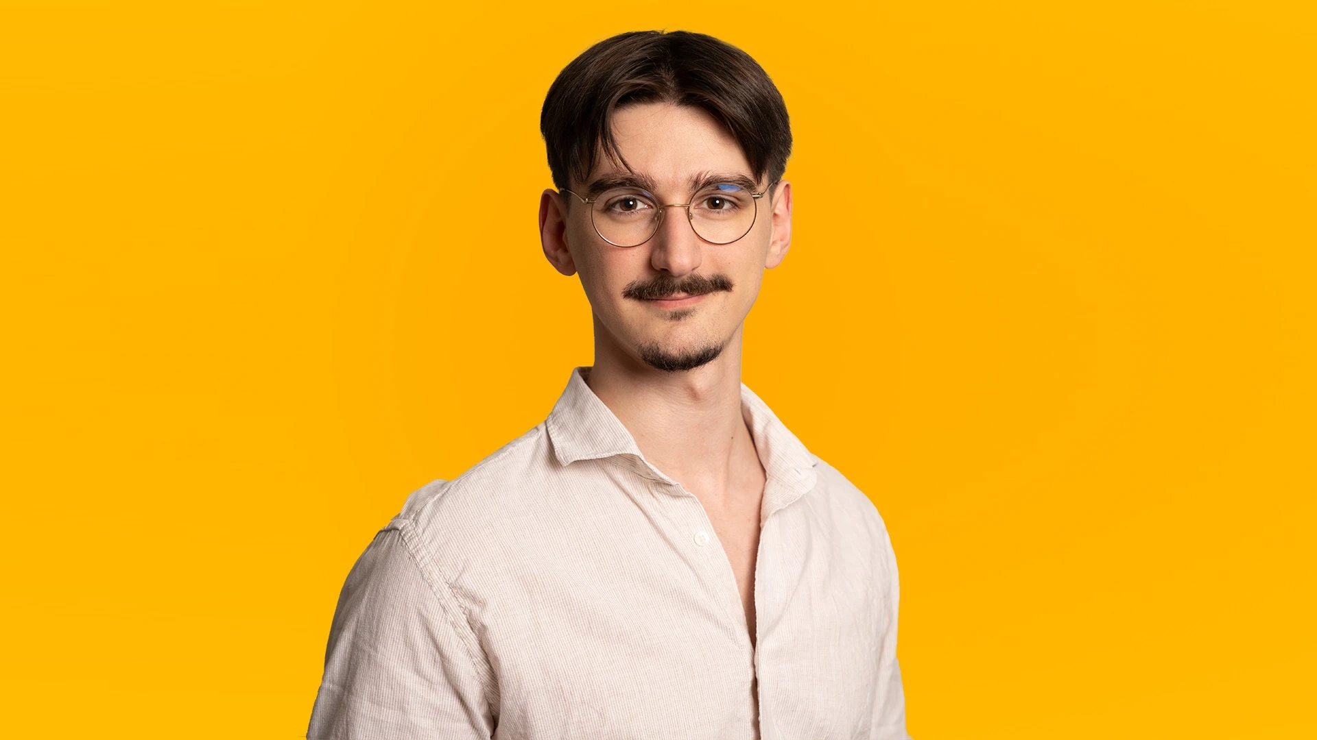 Young black woman witting at the table working on a laptop