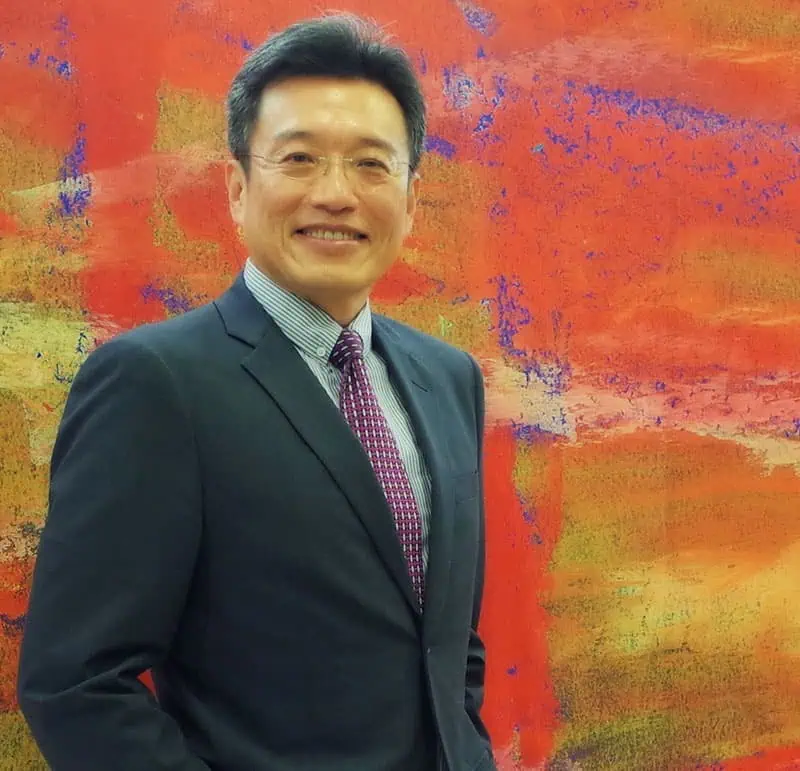 person sitting in a chair in front of a man