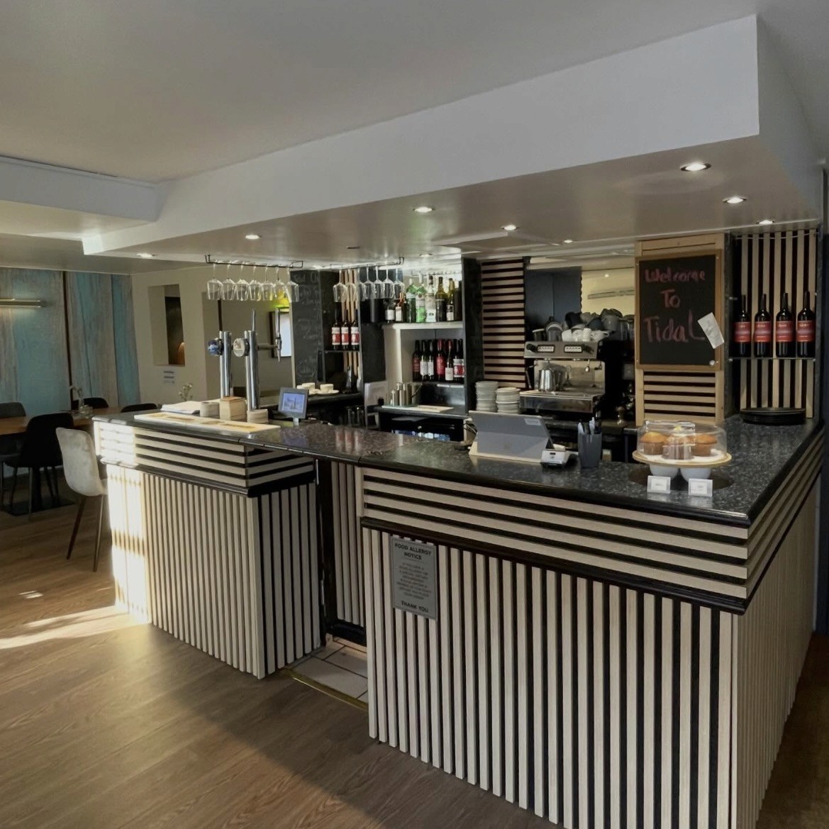 Modern bar with stools and soft lighting