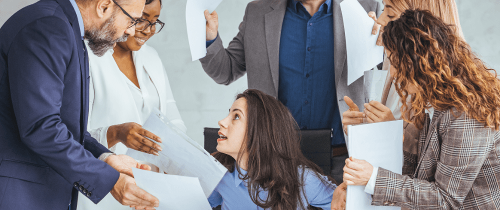 Woman surrounded by chaos at work