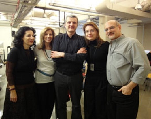 A photo of a group of people inside a workshop.