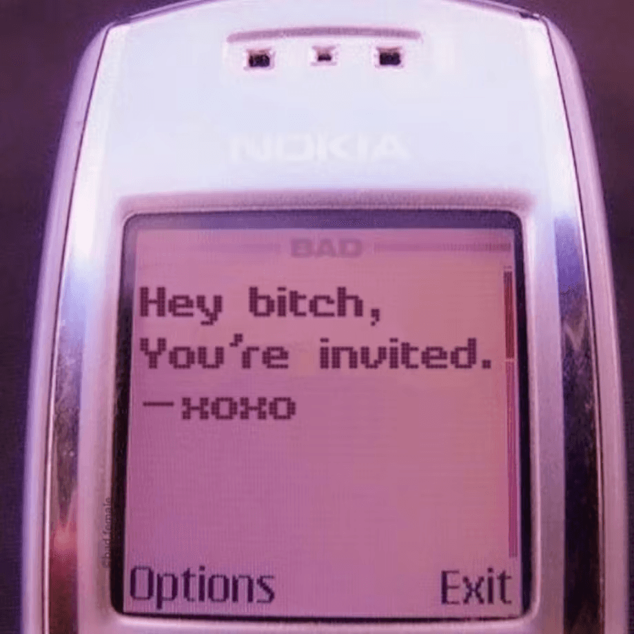 A close-up of a flip phone screen displaying a text message that reads: "Hey bitch, You're invited."