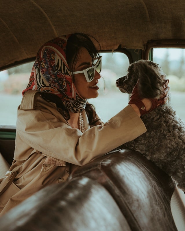 girl with dogg in car