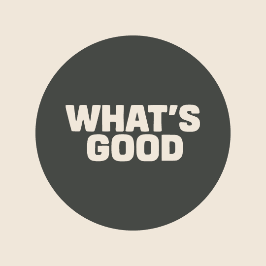 What's Good Directory logo includes the words "What's Good" in an off white font in a dark charcoal circle. 
