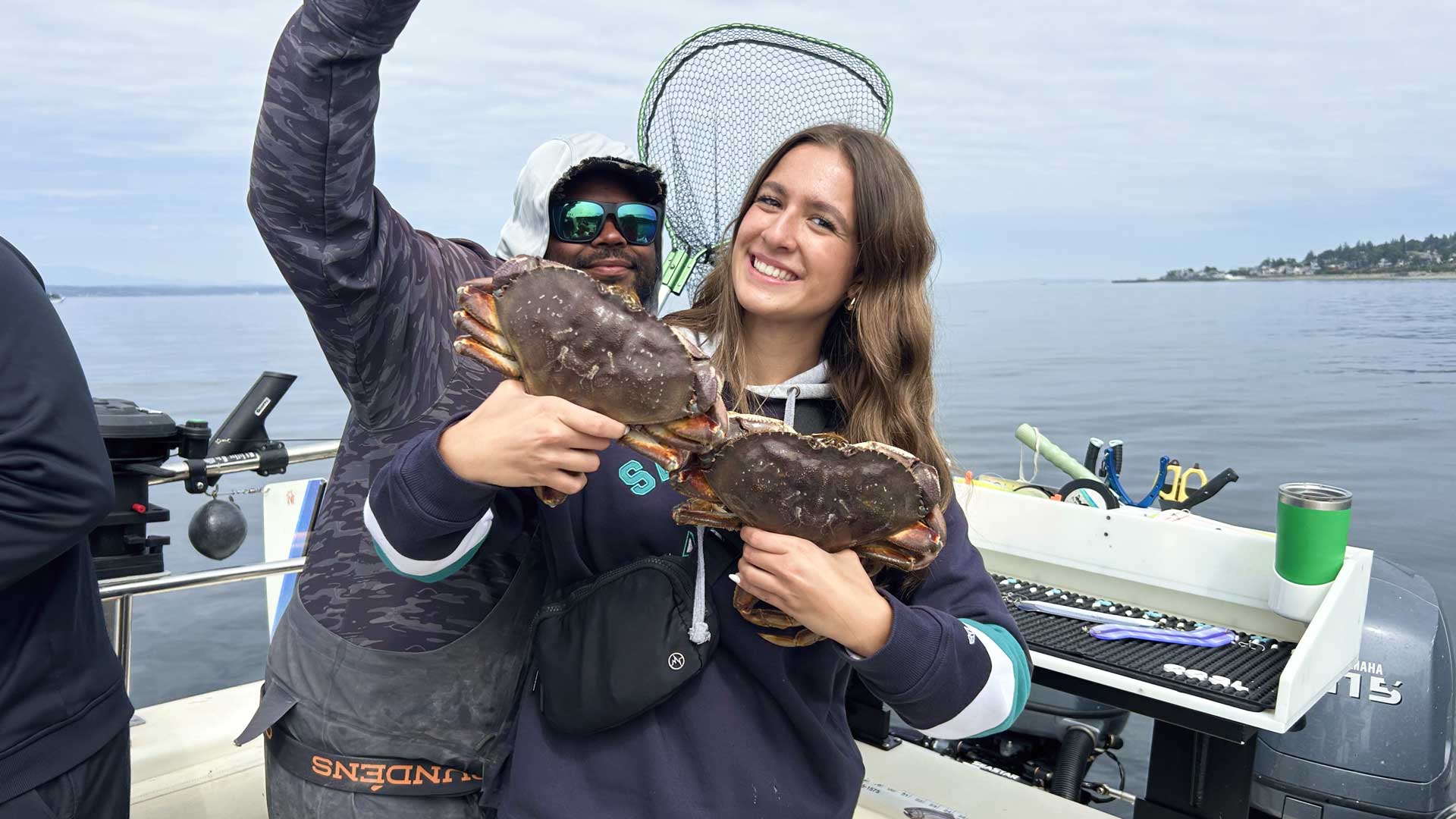 Woman holding freshly caught dungennes crab
