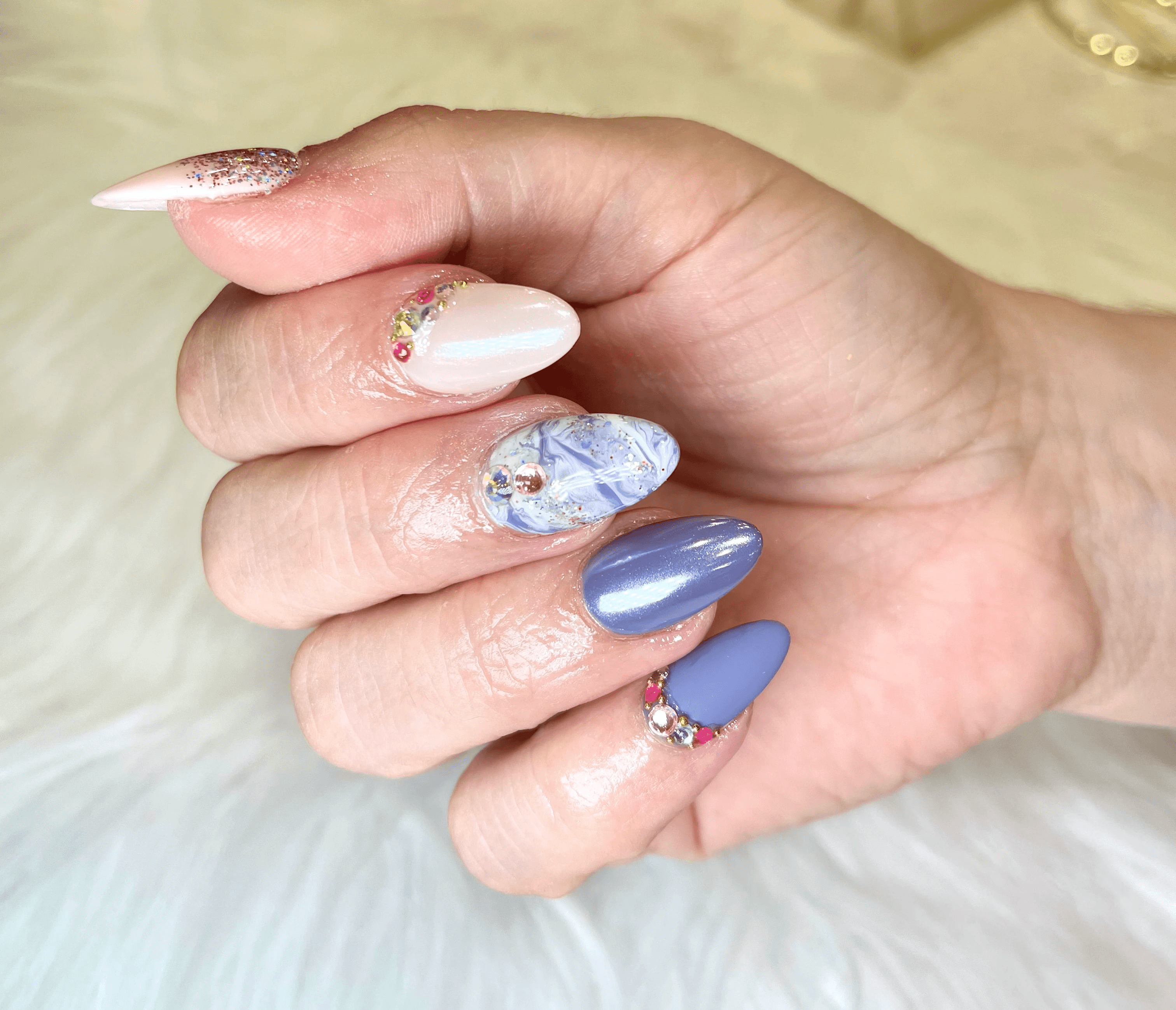 Gel-X nails with soft purple floral design in Naperville IL nail salon